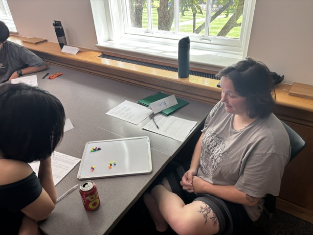 Two players start with 10 beads and take turns taking beads until someone takes the last bead and is declared a winner.