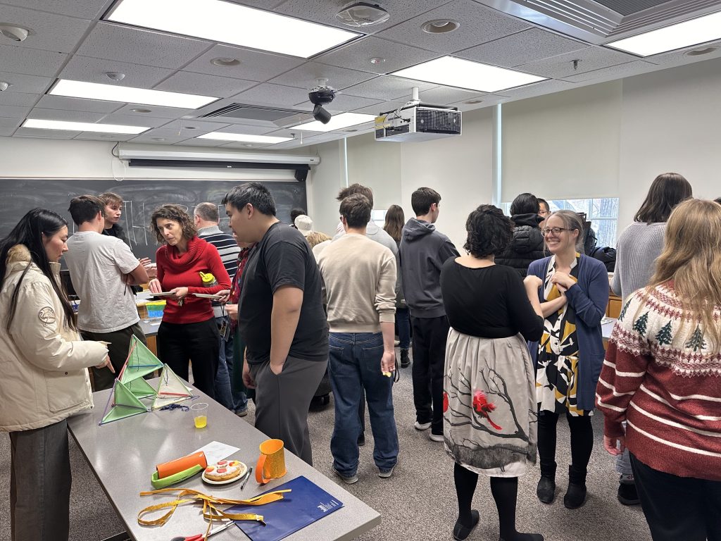 MATH 208 art show where students and faculty are checking out everyone's math-related art projects