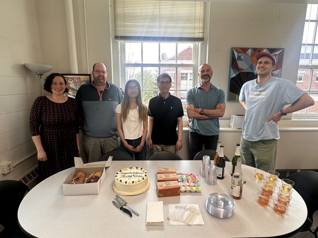Celebration for Phuong Cao and Hung Pham for completing their honors thesis presentations. They are side-by-side with their thesis advisors Prof. Berg and Prof. Ryan and Prof. Brooksbank and Prof. Schmid.